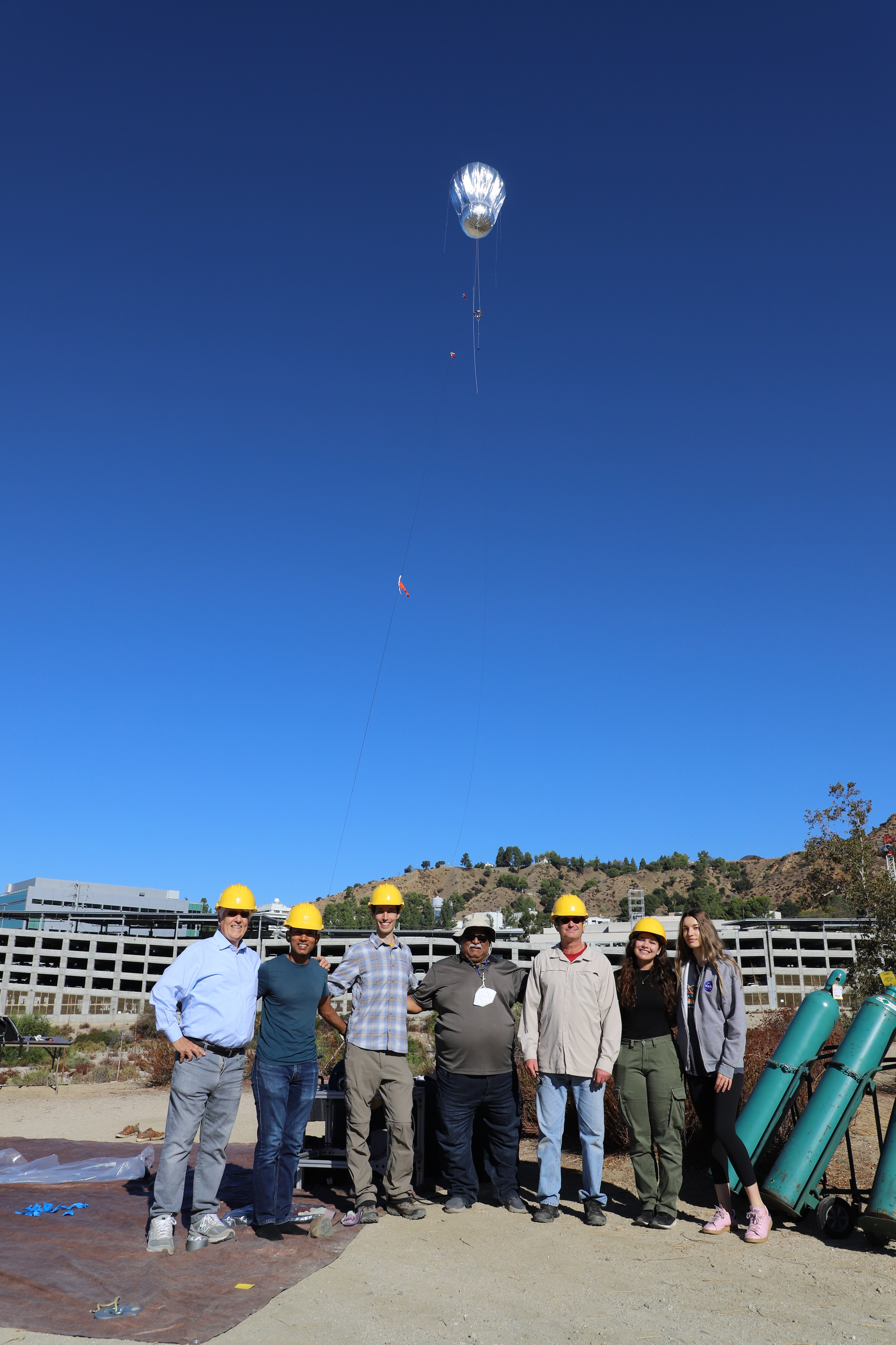  Picture: Group photo of tethered Venus aerobot flight at NASA-JPL. Left to right: Jim Cutts, Ashish Goel, Jacob Izraelevitz, Kirk Barrow, Mike Pauken, Tonya Beatty, Carolina Aiazzi